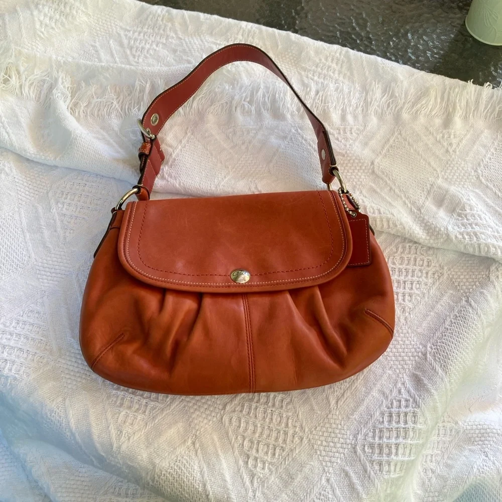 Coach SoHo, Burnt Orange Leather Shoulder Bag EUC, picture 8 shows a tiny dot - Picture 1 of 13